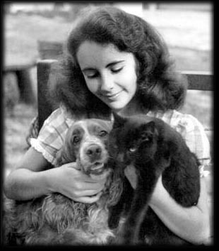 A young Liz with a dog and cat, courtesy of Stick's Silver Screen Siren Website