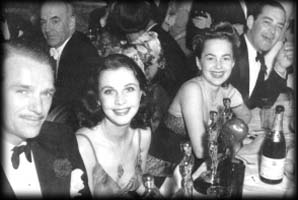 At the Oscars: Douglas Fairbanks (Jr), Vivien, Olivia de Havilland, and Jock Whitney, 1940. Olivier snapped this photo.